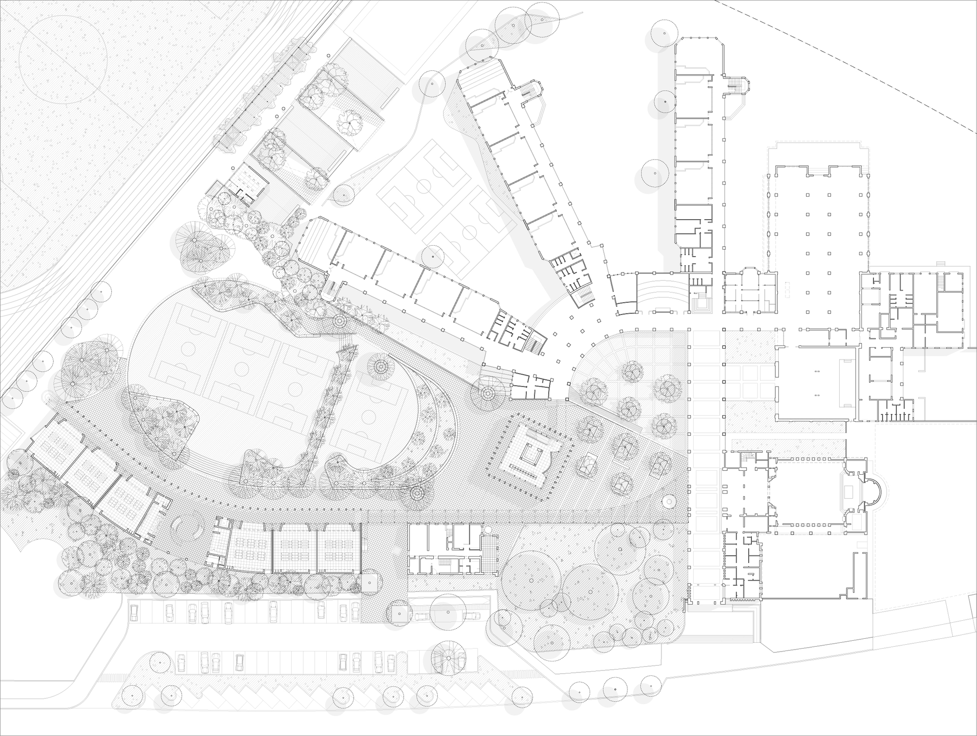 Site plan drawing showing multiple buildings, landscaped areas, pathways and circular tree plantings