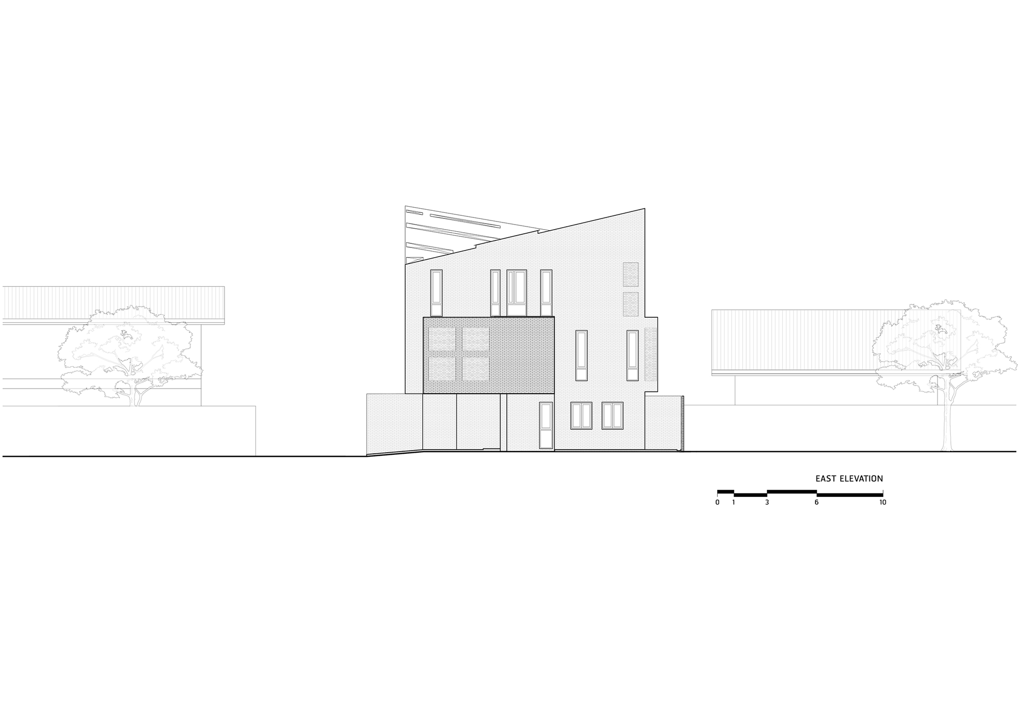 East elevation drawing showing a two-story volume with angled roofline and flanking trees