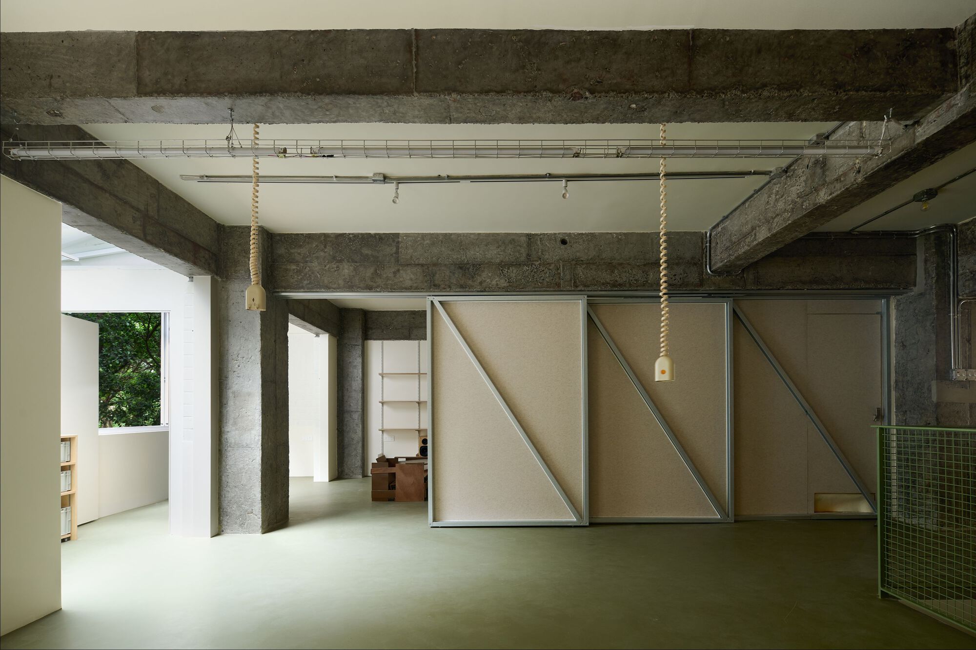 View of the movable partition panels in a closed configuration revealing diagonal timber bracing