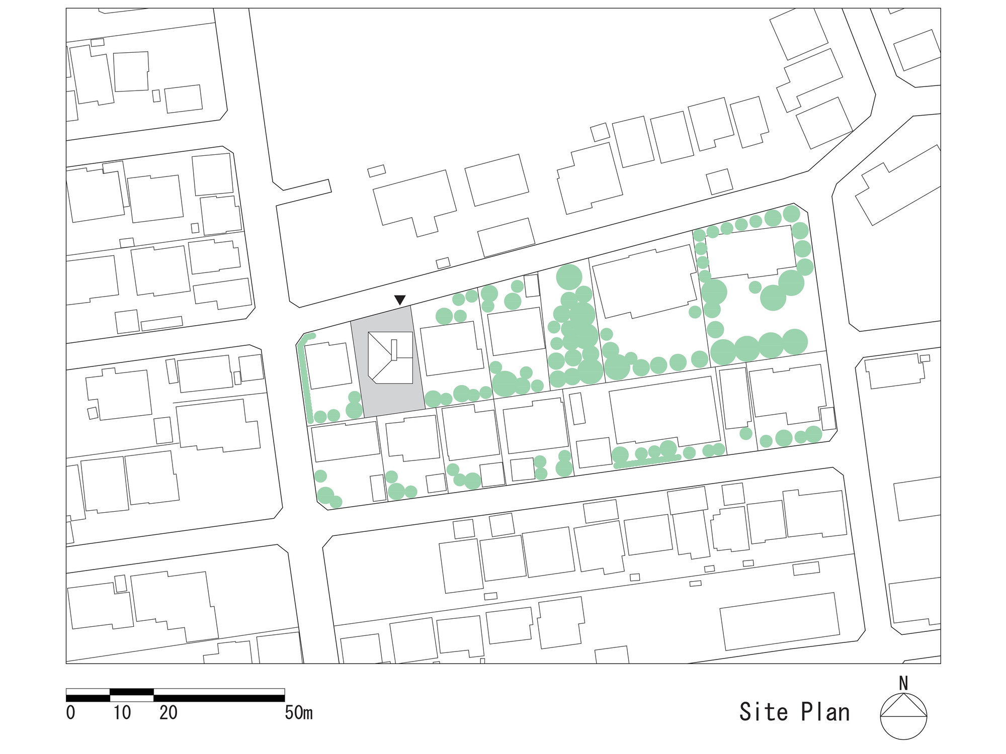 Site plan drawing showing building footprints and street trees in a dense residential block