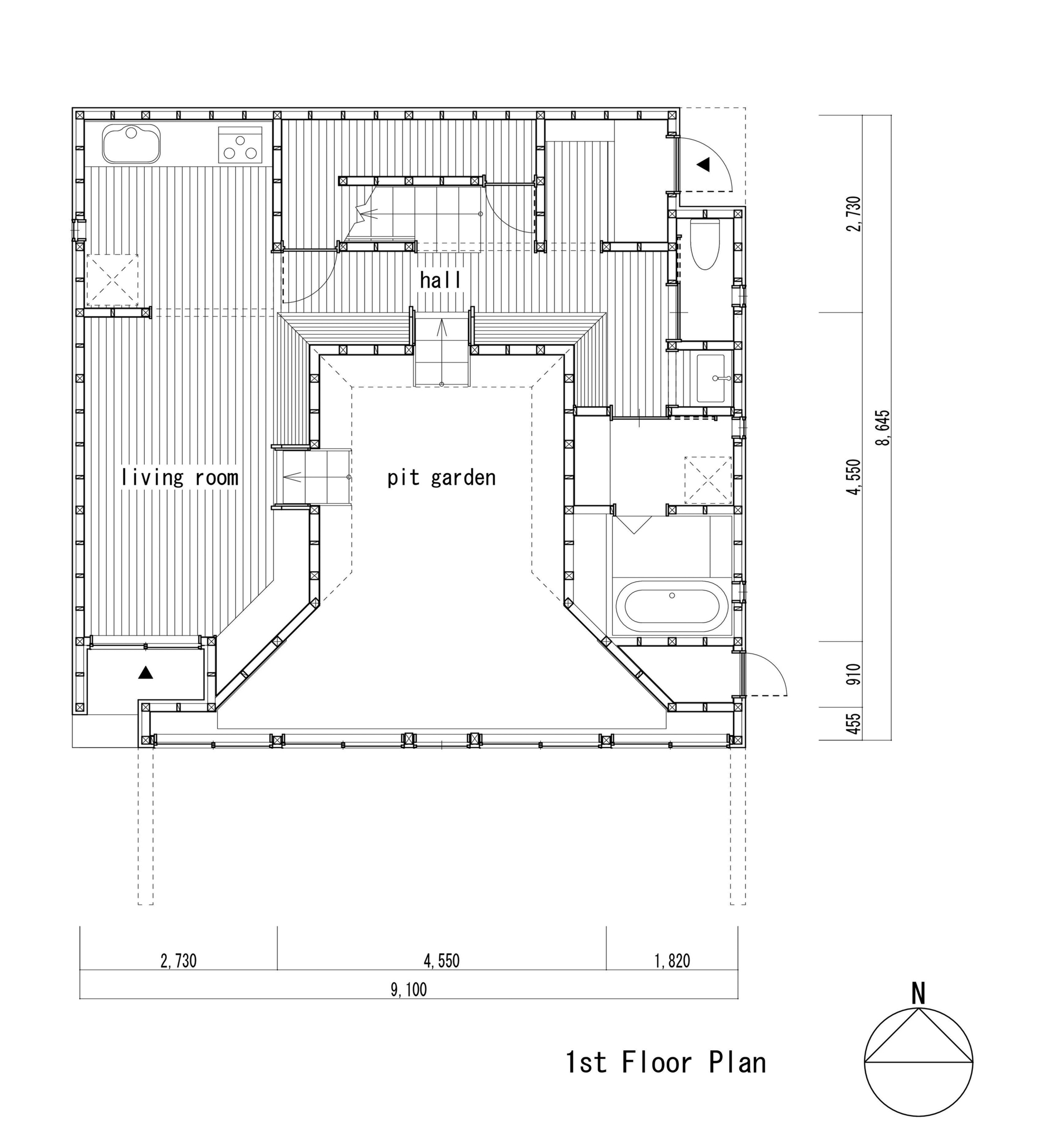 First floor plan showing rooms arranged around a central pit garden with hatched wood decking