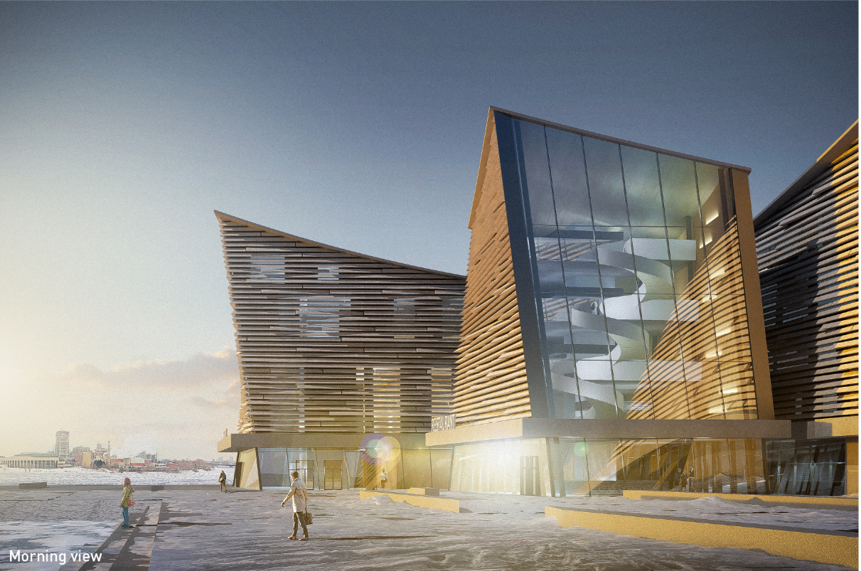 A glazed entrance volume contrasts with the building’s textured, stone-like masses.