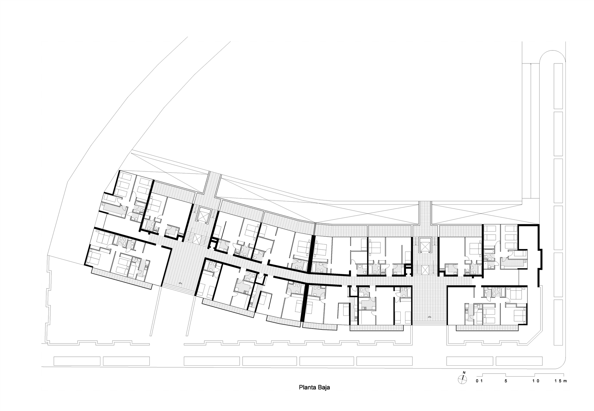Ground floor plan revealing curved building footprint with outdoor terrace along street edge