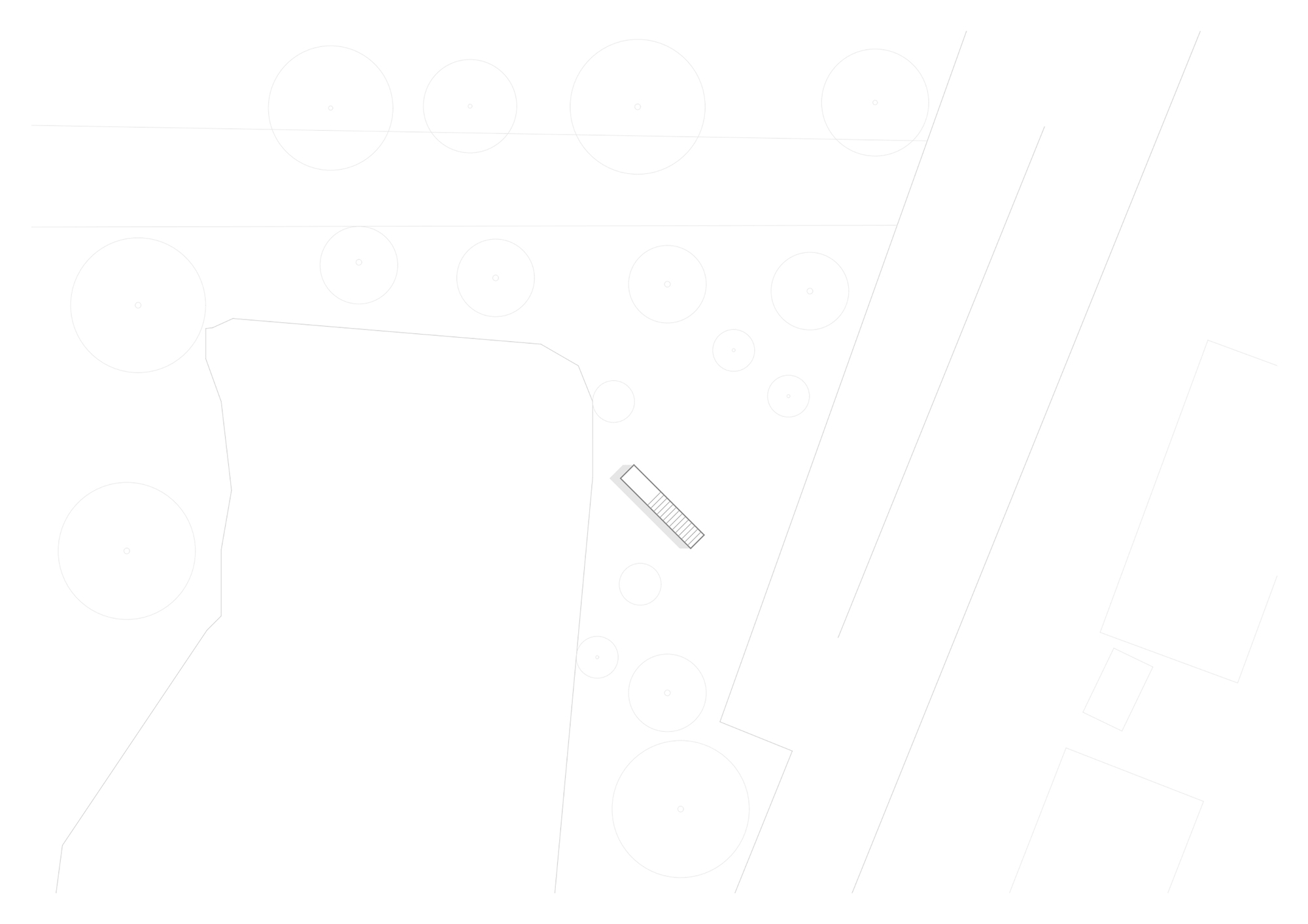 Site plan drawing depicting the elongated building form on sloping terrain between organic boundaries