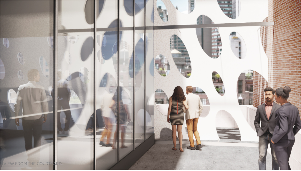 Courtyard view framed by glazing and the perforated titanium dioxide facade.