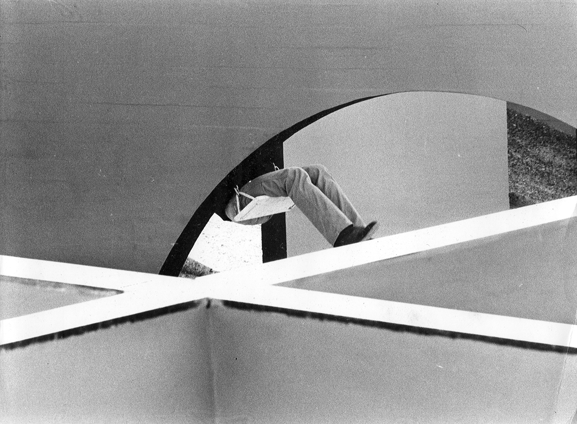 White painted handrail intersection with figure ascending a curved stairway