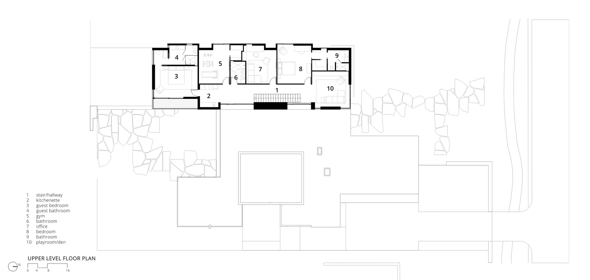 Upper level floor plan showing bedroom wing, central stairwell and balcony overlooking the courtyard