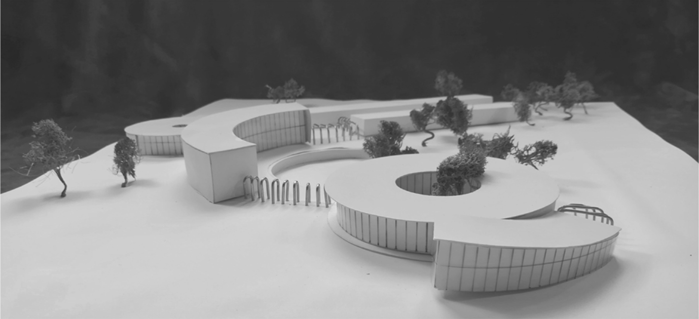 Physical model of the three interconnected lobed volumes with circular courtyards and vertical glazing