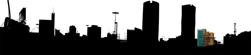 Silhouette of the city skyline with construction cranes and high-rise towers against an overcast sky