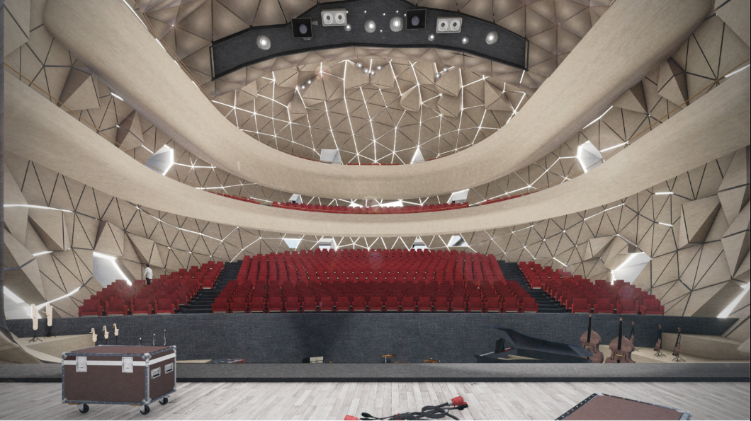Auditorium interior with red tiered seating and geometric ceiling with suspended lighting rig