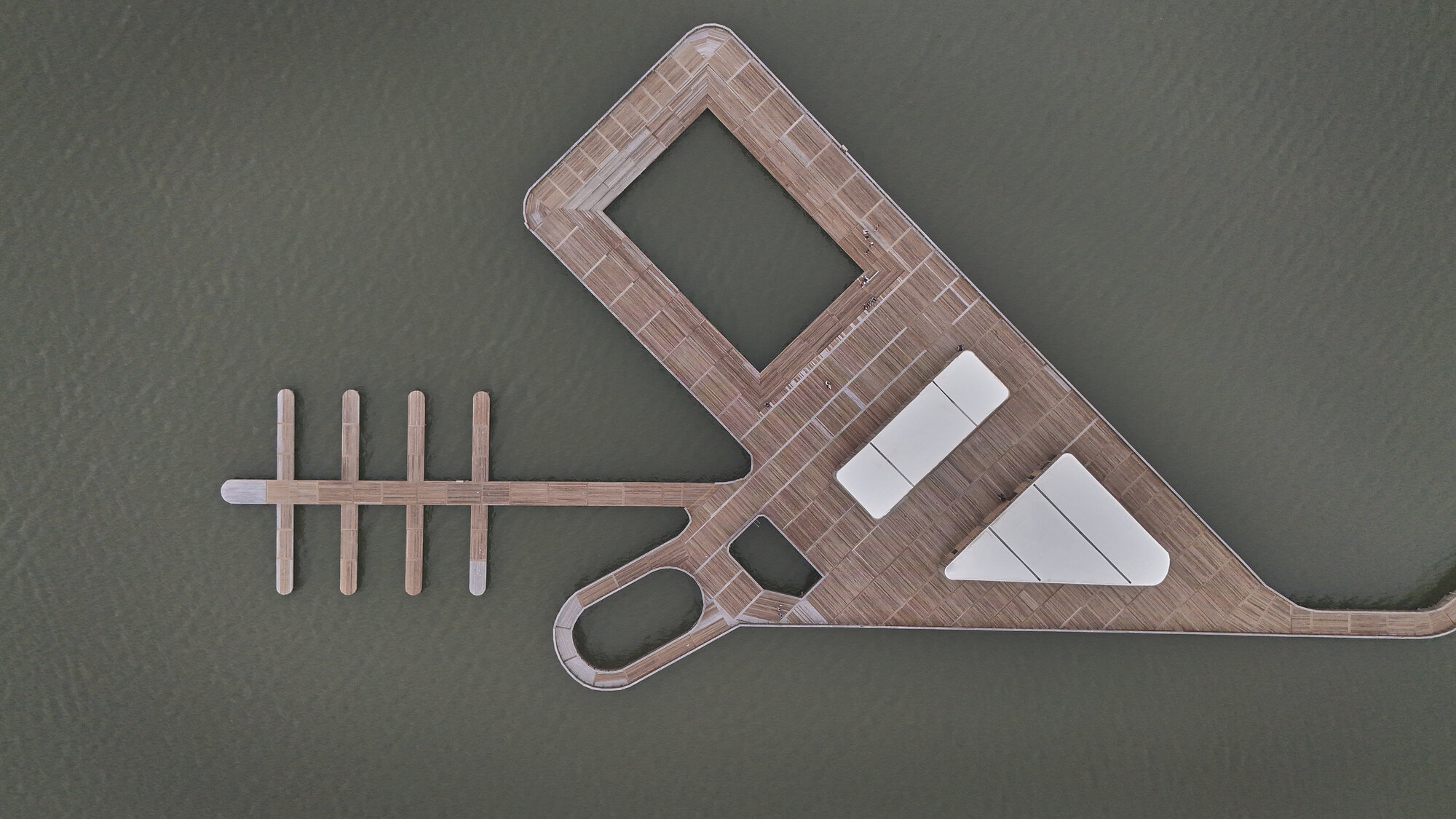 Drone view of the entire timber boardwalk network with circular viewing platforms and finger docks