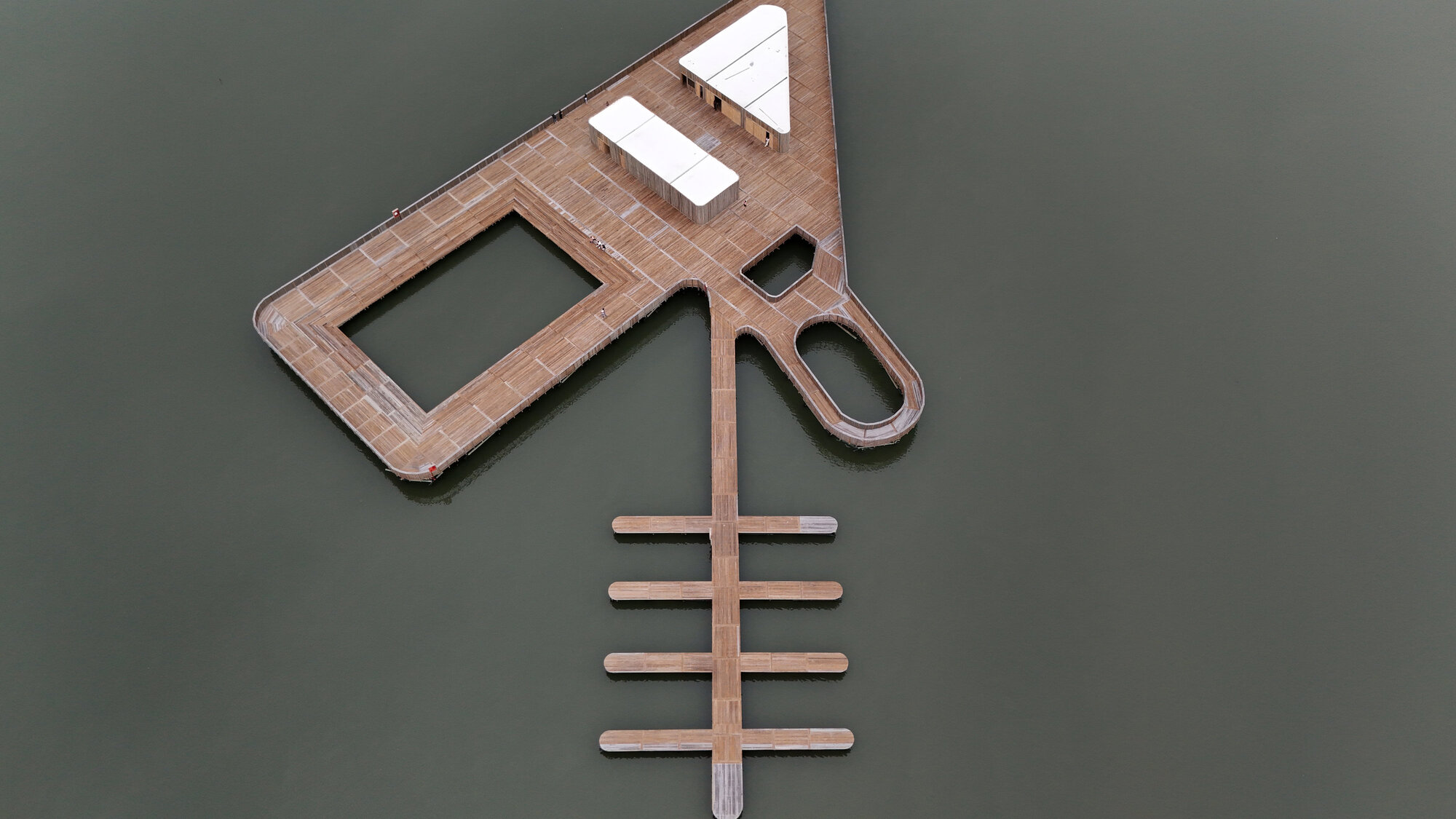 Top-down view of the timber boardwalk plan showing its branching geometry over dark water