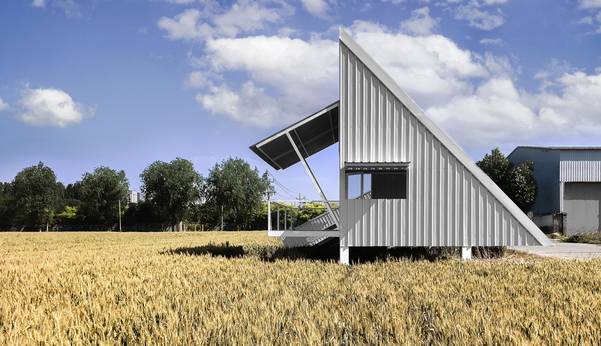 Side view of the cantilevered observation tower with open framework beneath partly cloudy skies