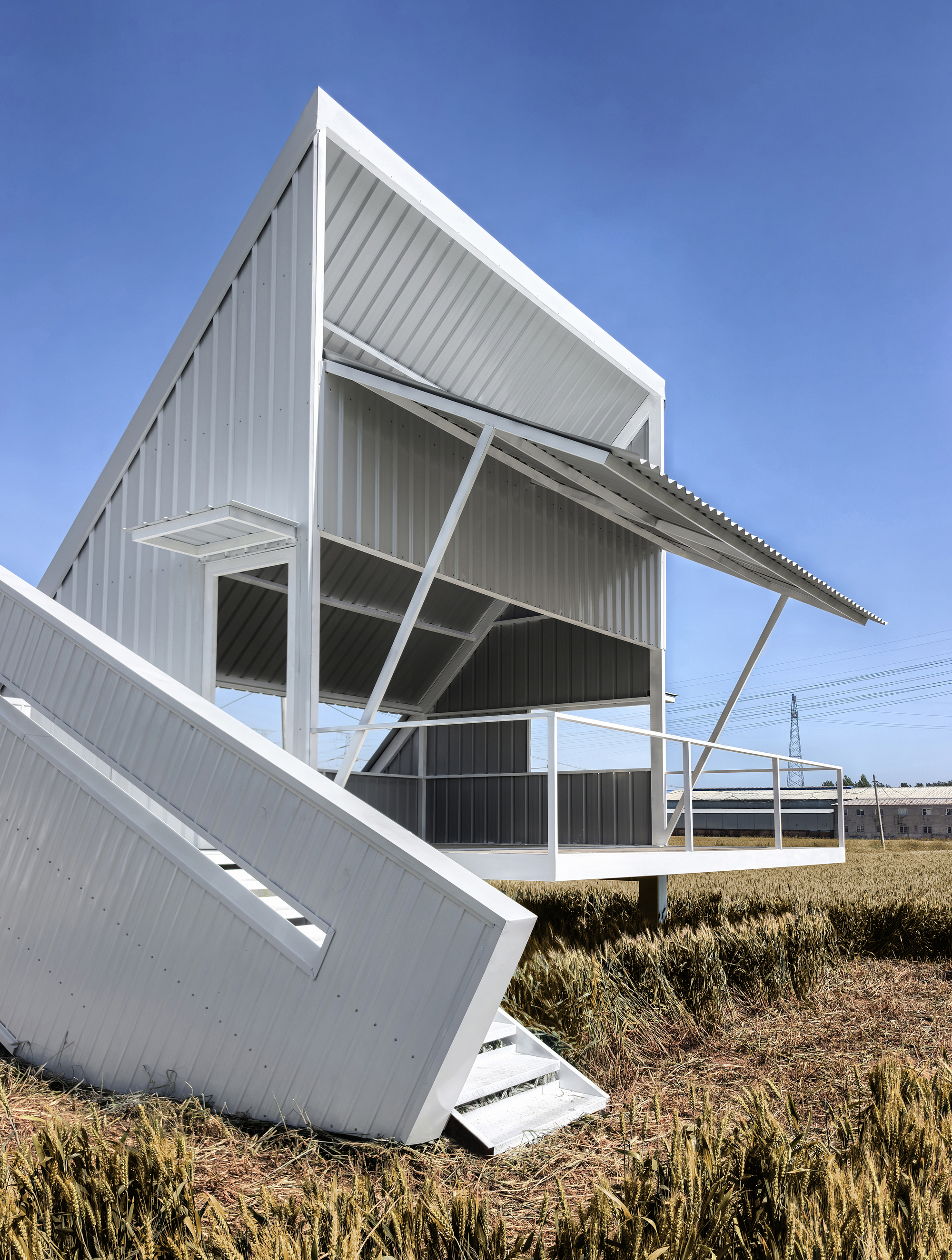 Close-up of the angular steel frame supporting corrugated metal roof and wall panels
