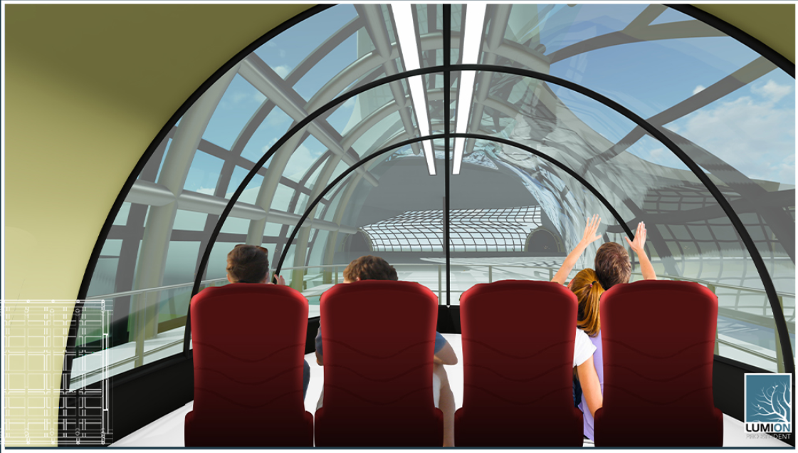 Four visitors seated in red chairs beneath a transparent arched canopy overlooking adjacent structural ribs