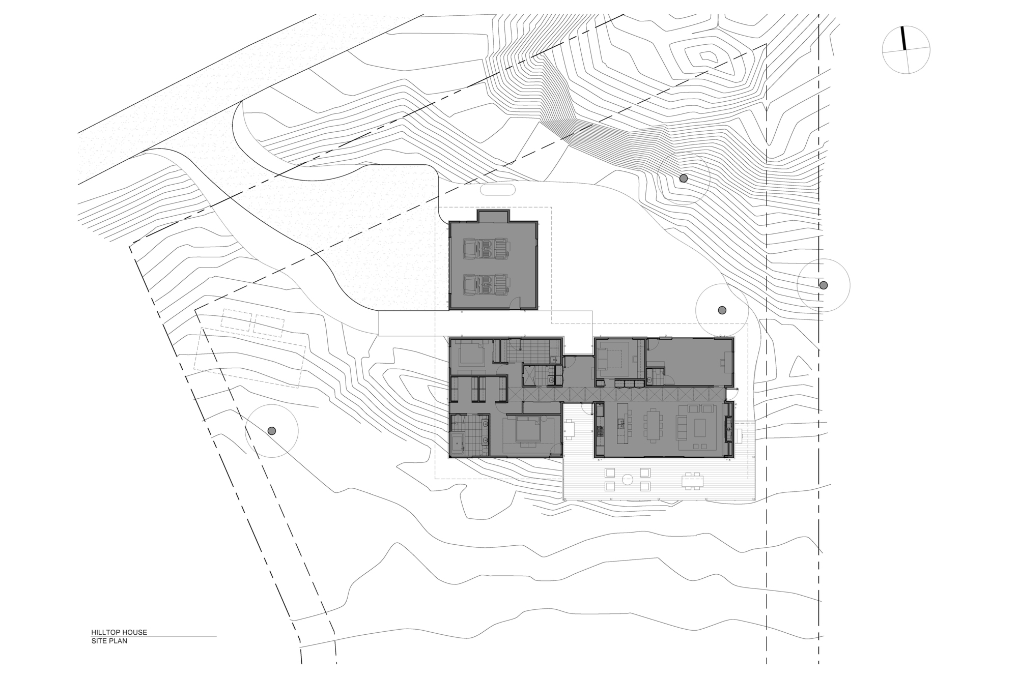 Site plan drawing showing building footprint on sloped topography with contour lines