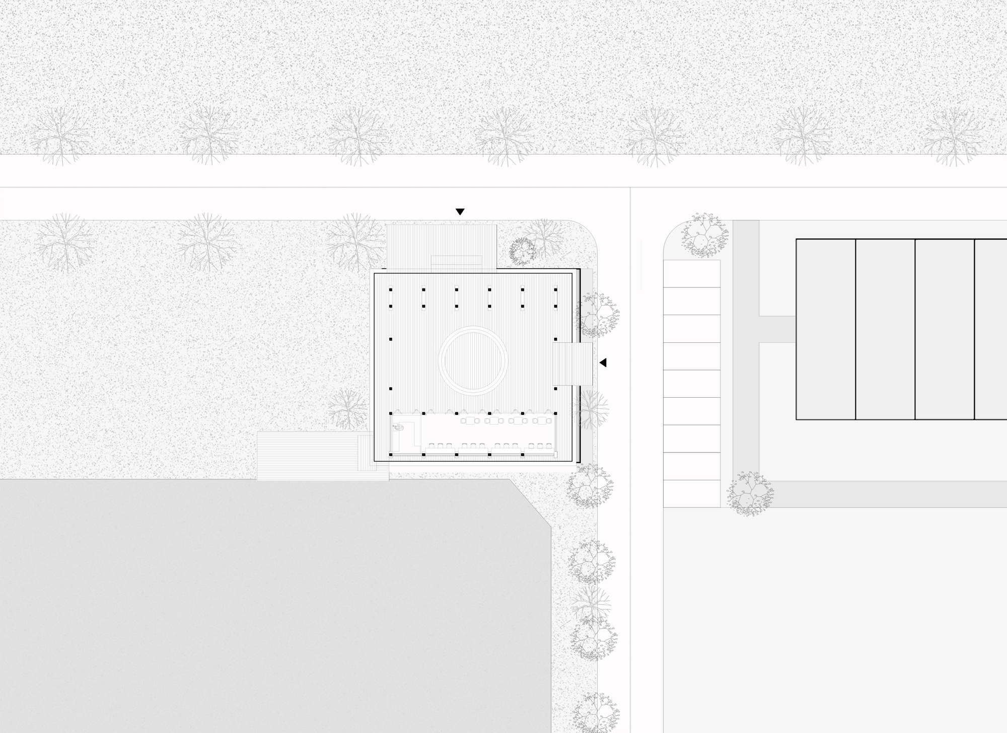 Site plan drawing showing a square building with central courtyard and tree-lined pathway to adjacent structure