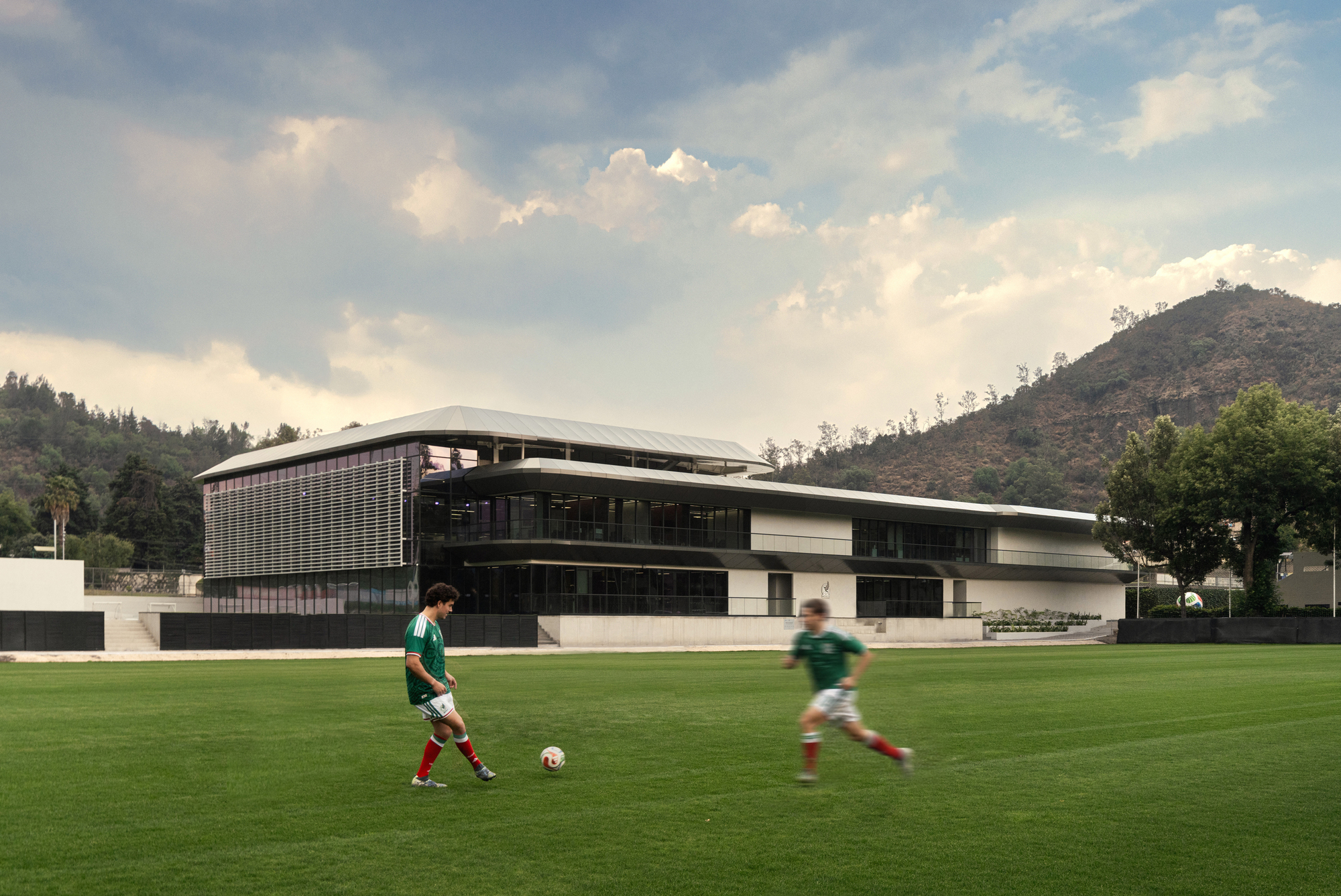 Layered facade with louvers and cantilevered volumes overlooking the soccer field with two players in motion