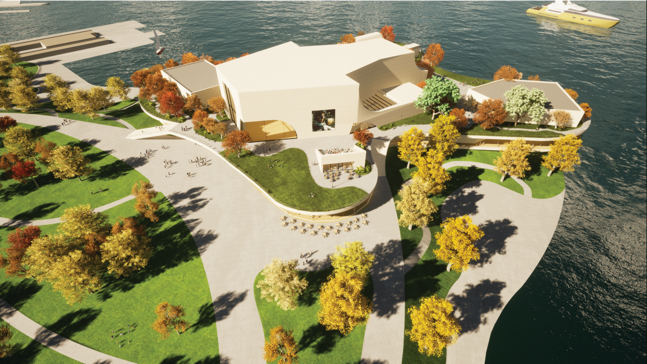 Aerial view of the white roofed building on a peninsula with autumn trees and green lawns