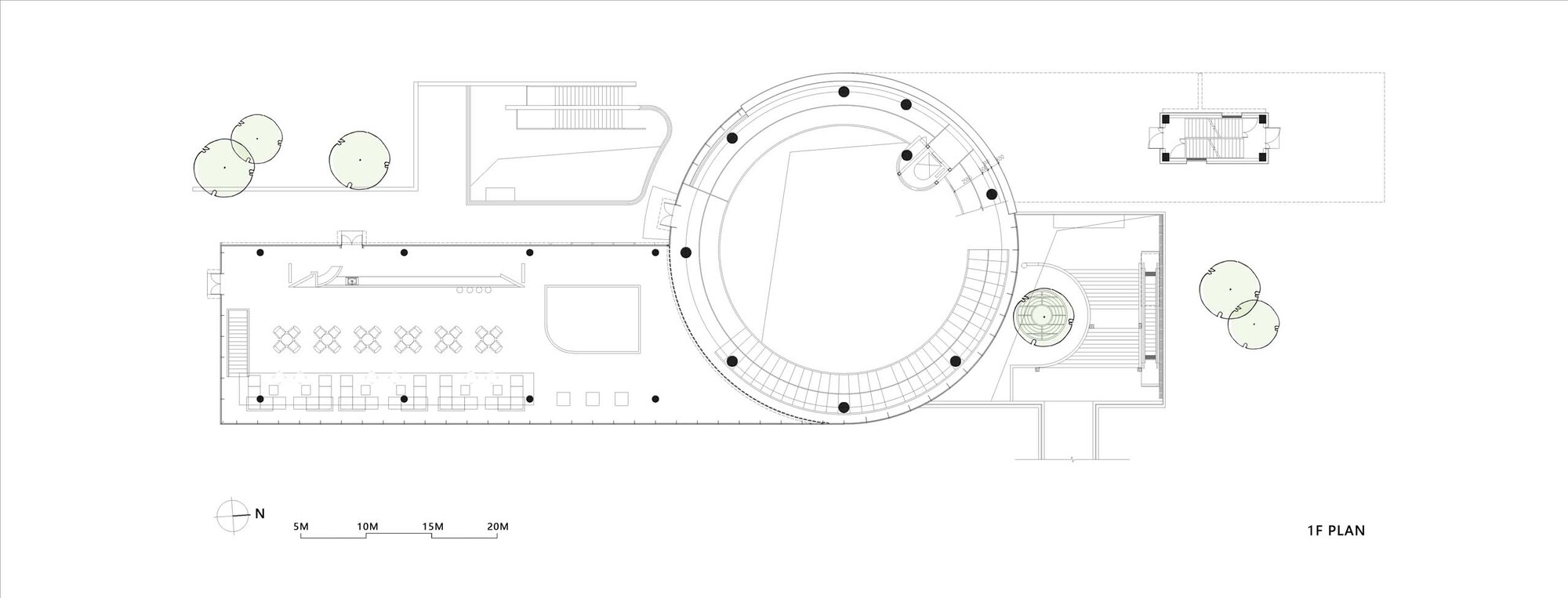 First floor plan showing circular volume connected to rectangular wing with dining and service spaces