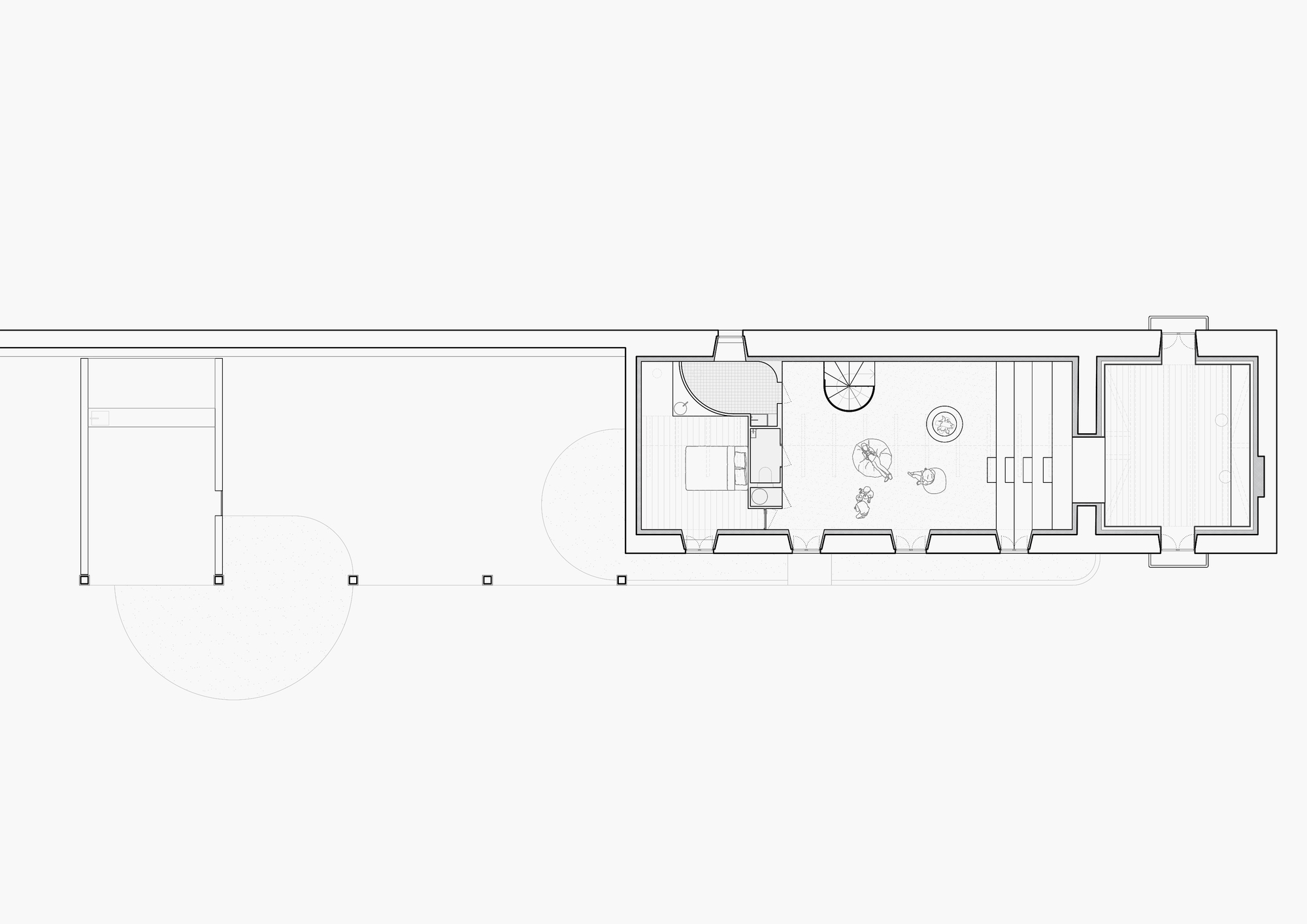 Floor plan drawing showing a linear layout with bathroom, bedroom, and circular courtyard element