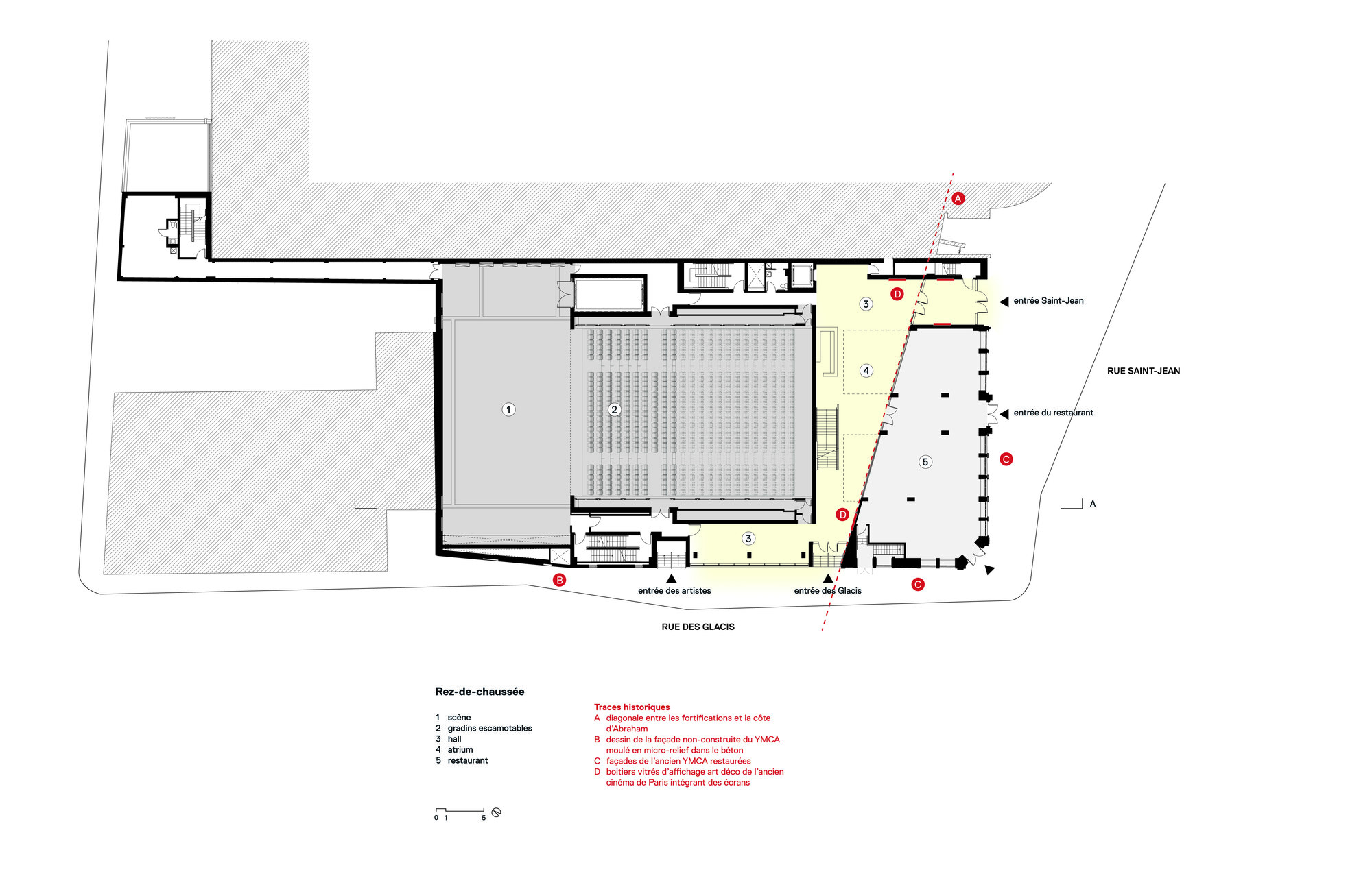 Ground floor plan drawing showing a large auditorium with seating rows adjacent to an angled lobby space