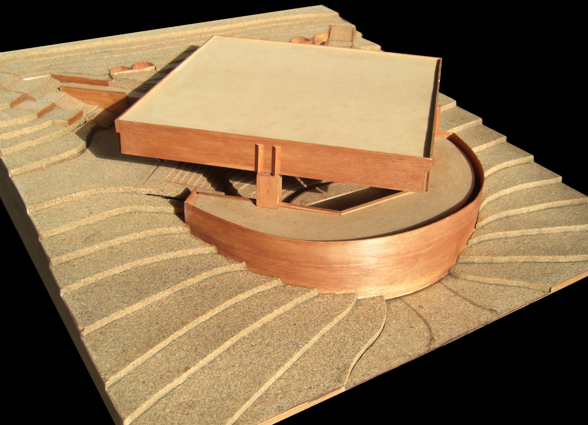 Physical model showing the curved ramp, terraced landscape, and flat roof volume from above