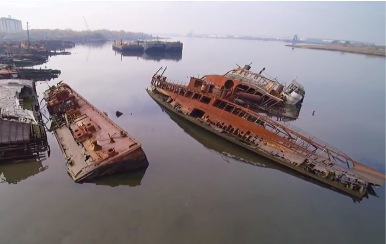 Abandoned ship structures inspire CityScraper’s recycled material strategy and industrial urban character.