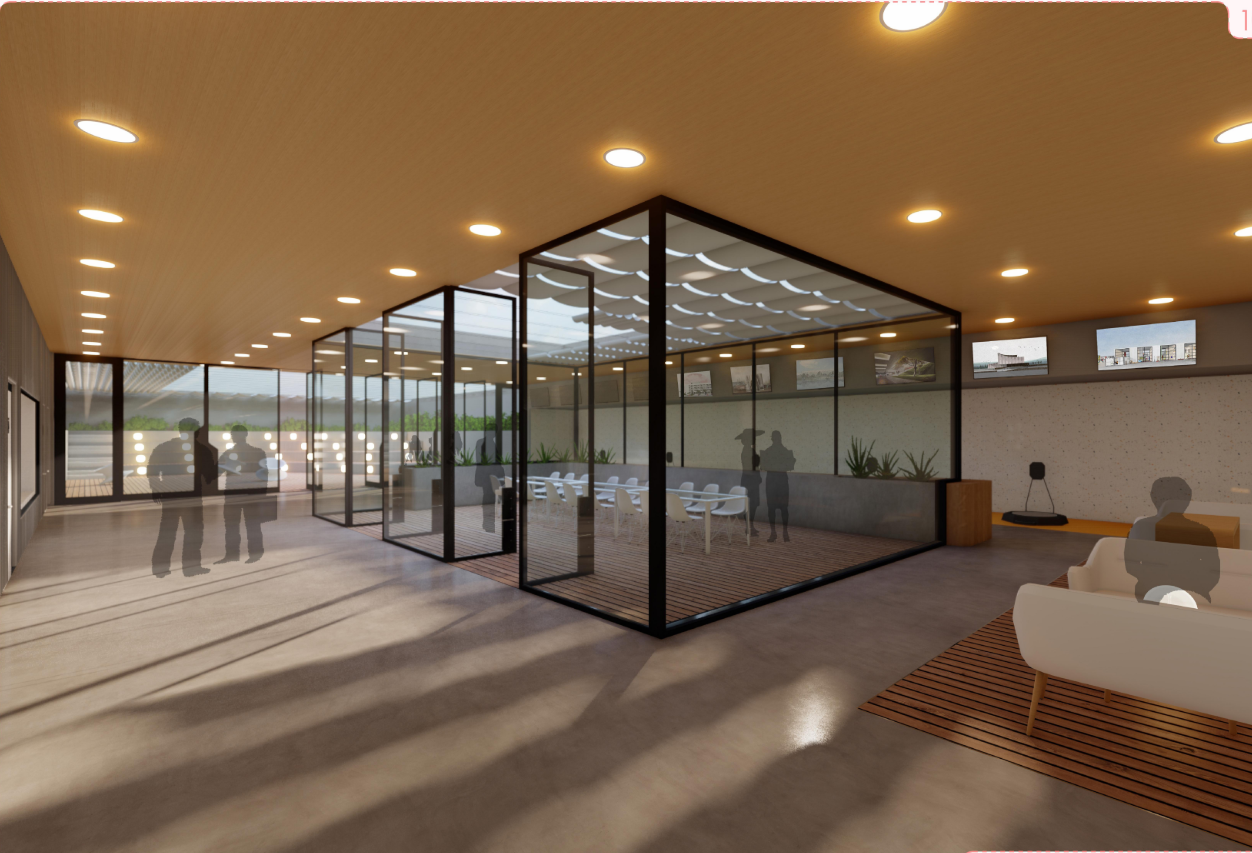 A collaborative interior zone where glass enclosures, display walls, and open circulation support design learning.