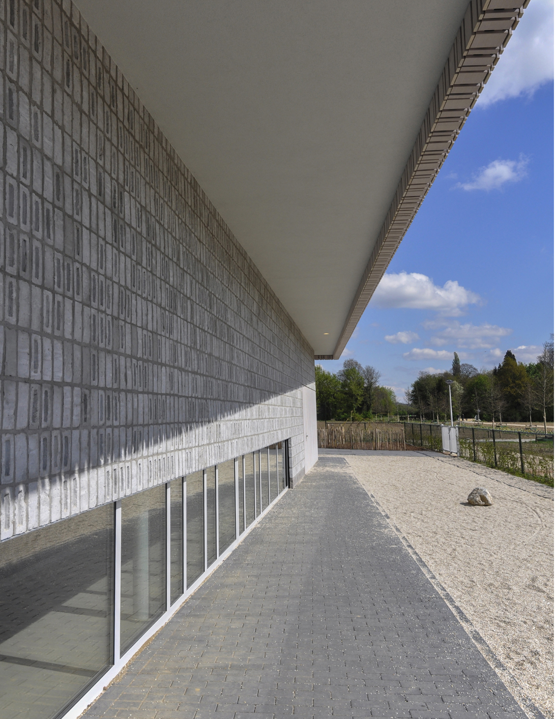 Shaded outdoor edges extend learning beyond classrooms into the landscape.