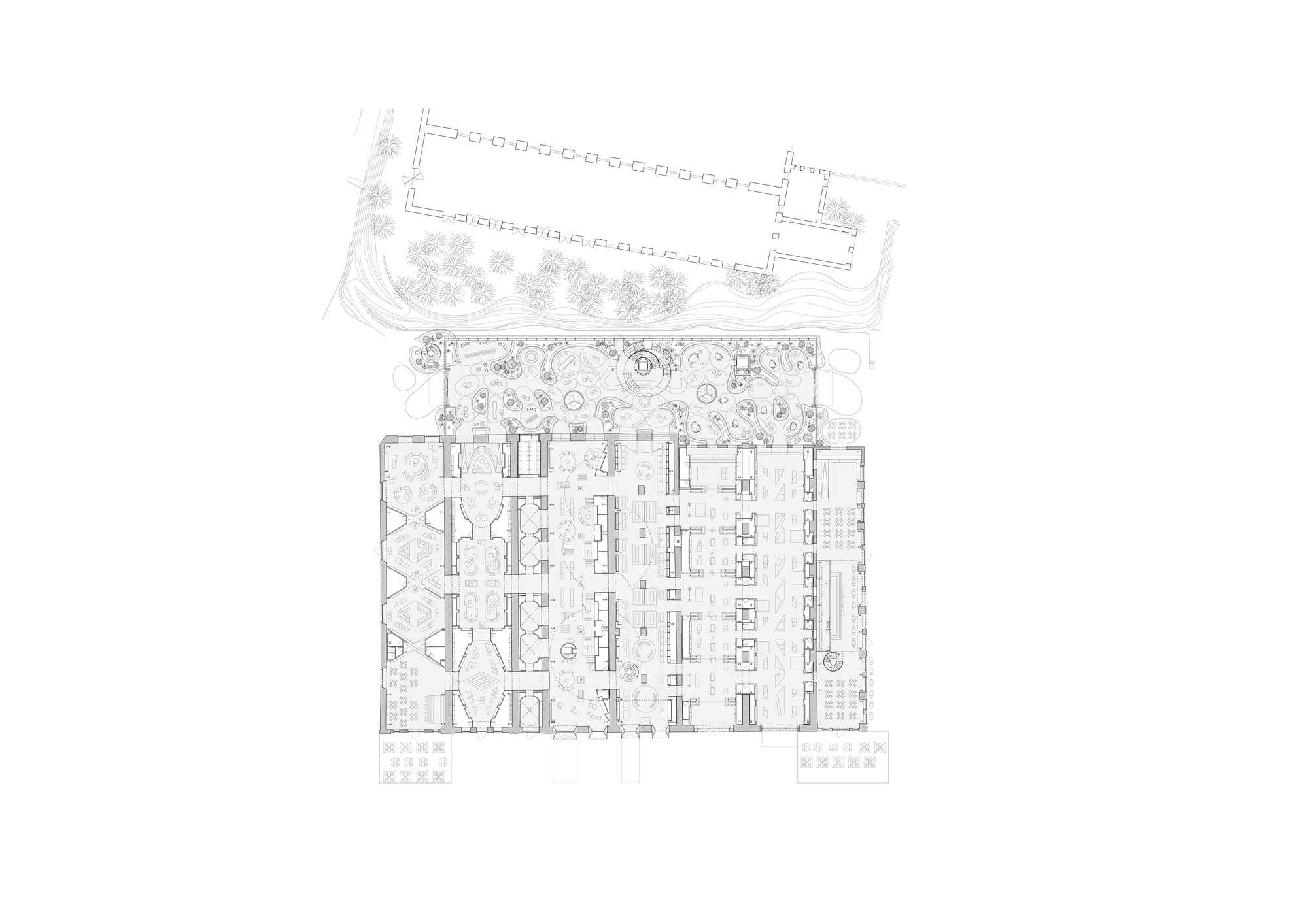 Floor plan drawing showing an interior workspace flanked by a landscaped courtyard and service areas