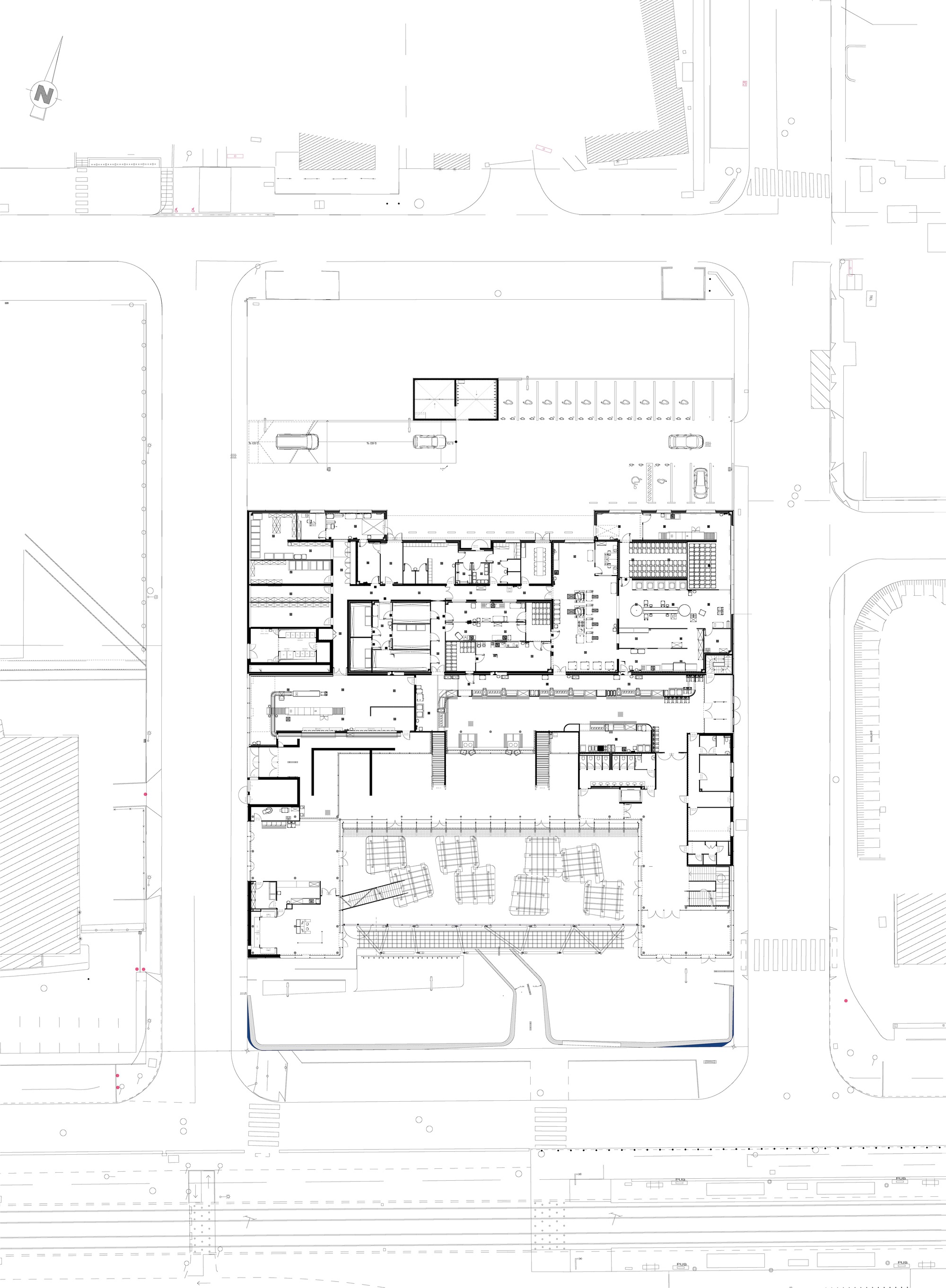 Floor plan drawing showing a rectangular building footprint with interior rooms and surrounding street context