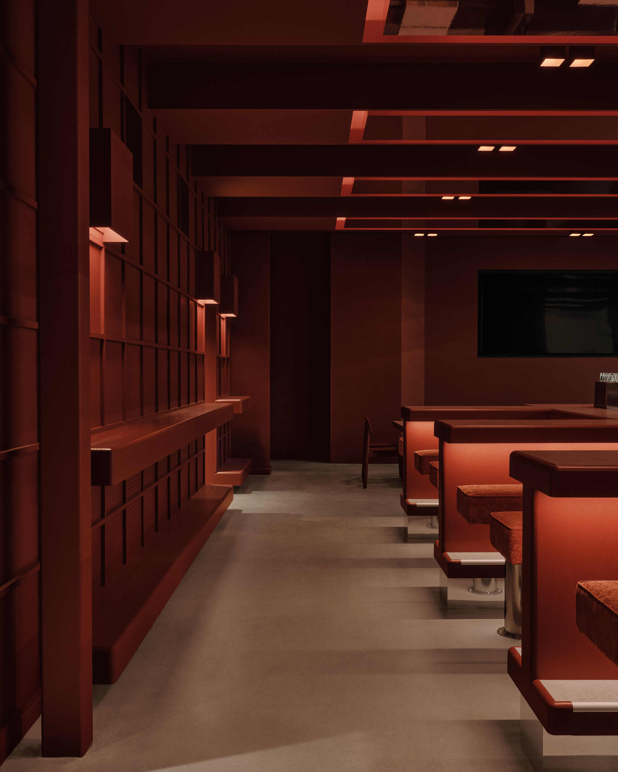 Seating area with gridded storage wall, horizontal beam ceiling system, and concrete floor under warm lighting