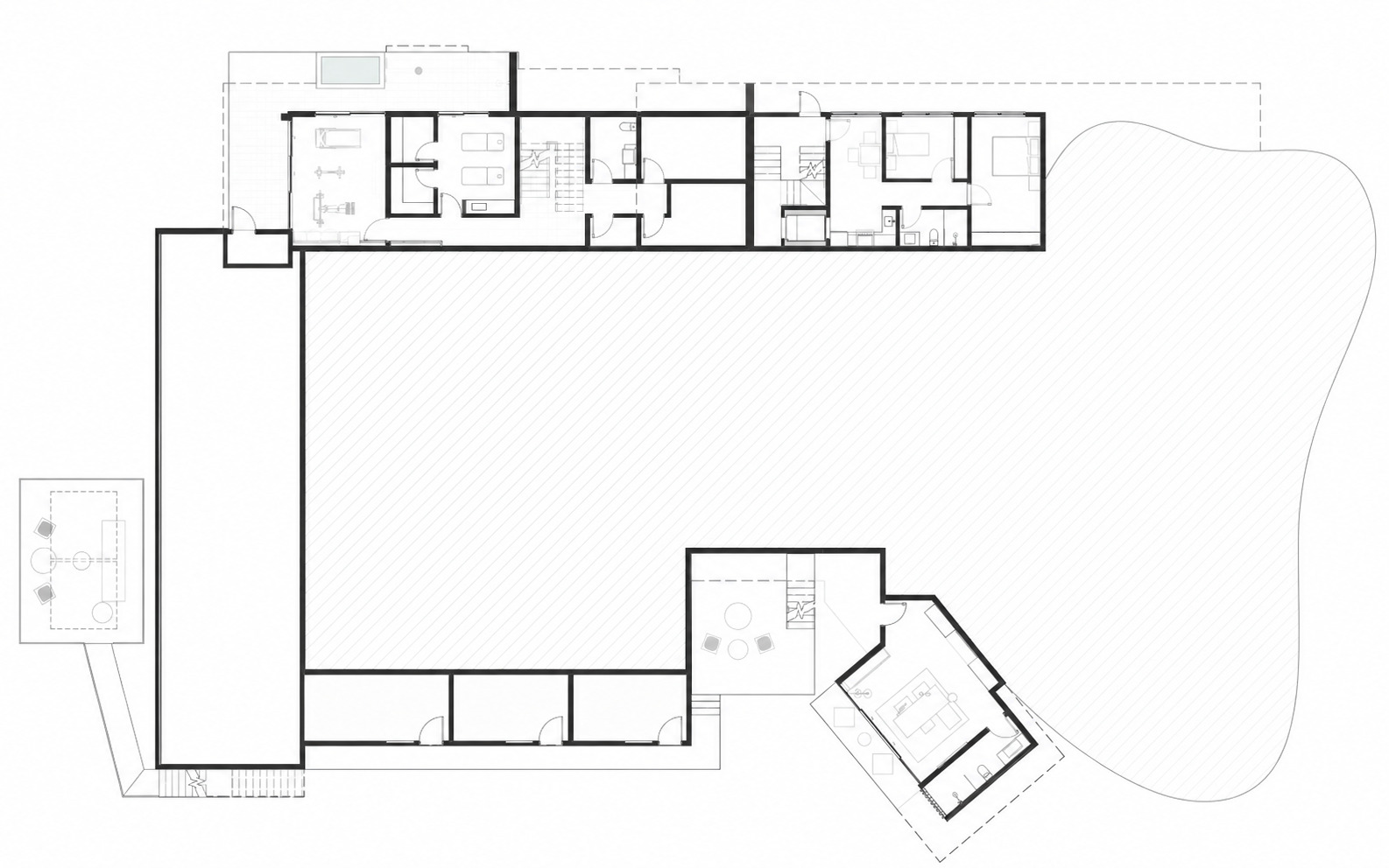 Floor plan drawing showing linear bar of rooms with angled pavilion and pool terrace