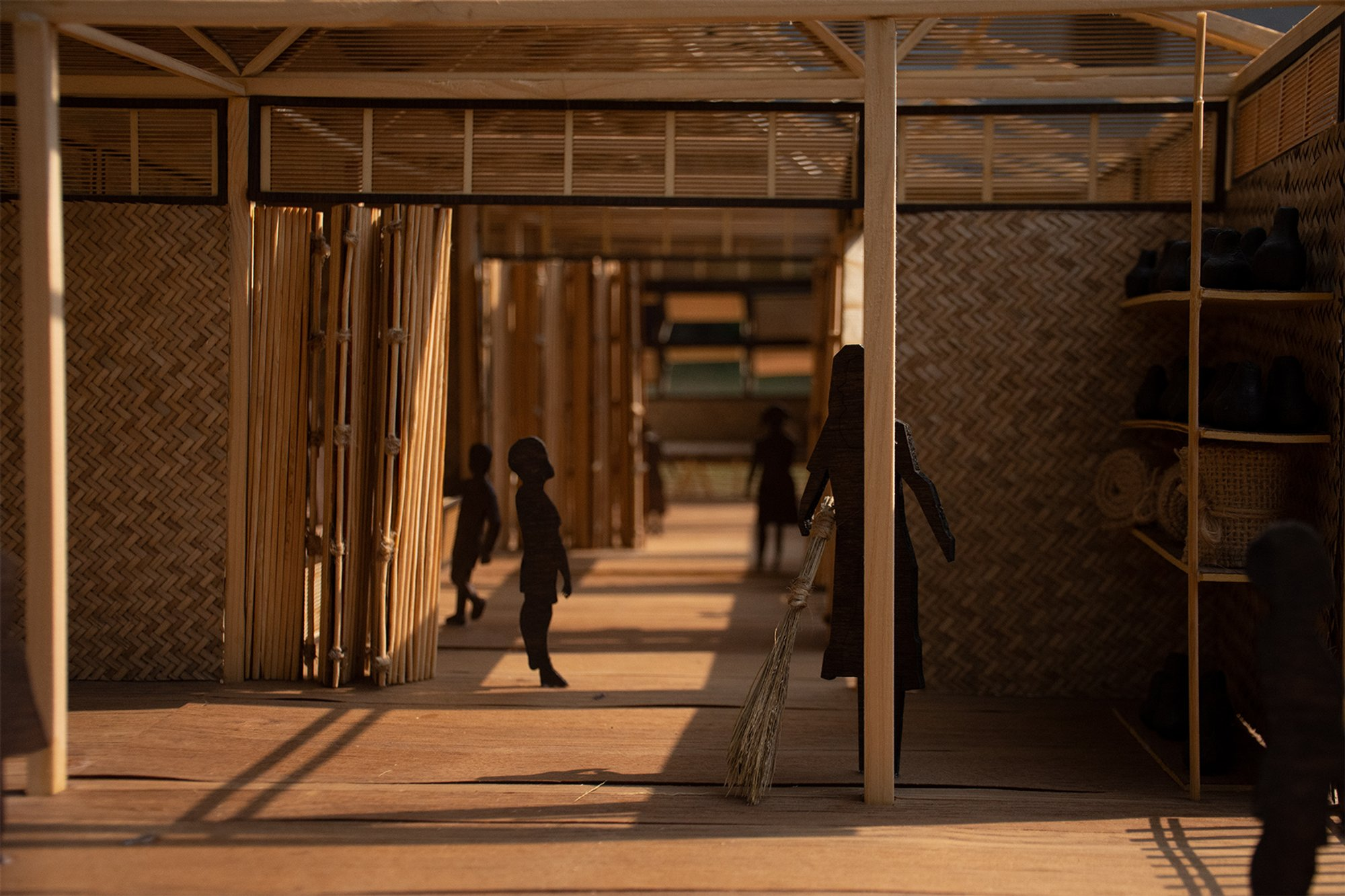 Warm bamboo interiors connect movement, family life, and everyday communal activities.