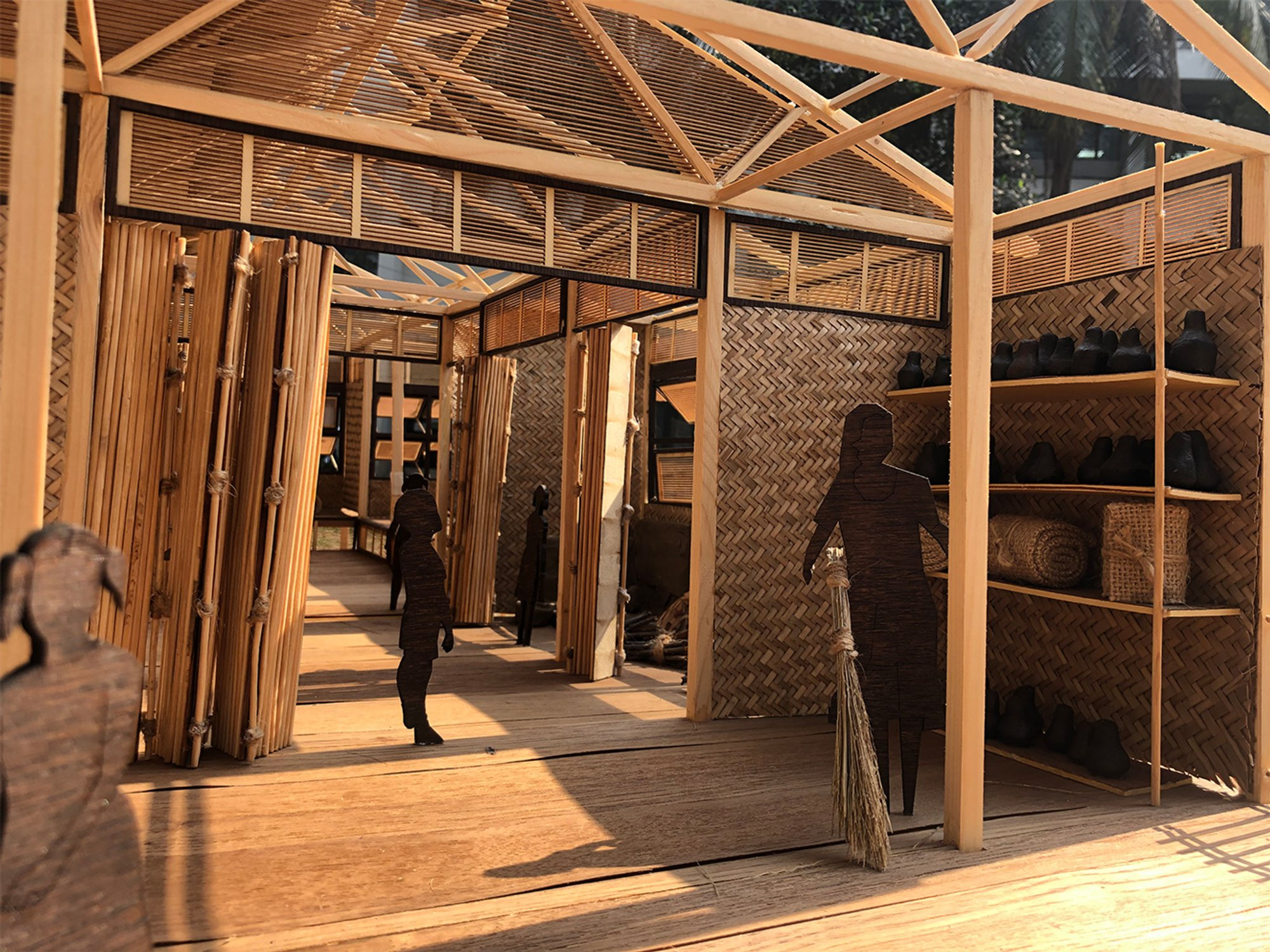 Detailed model showcasing woven walls, bamboo partitions, natural ventilation, and flexible shared spaces.
