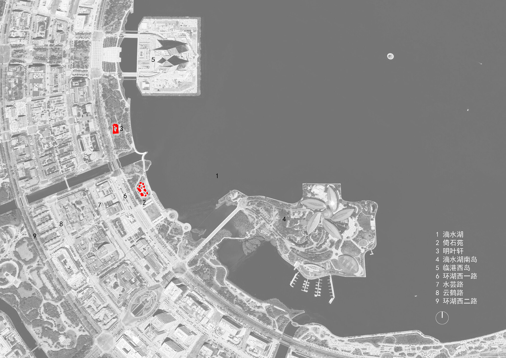 Site plan drawing showing two marked structures along a curved waterfront with urban fabric to the west