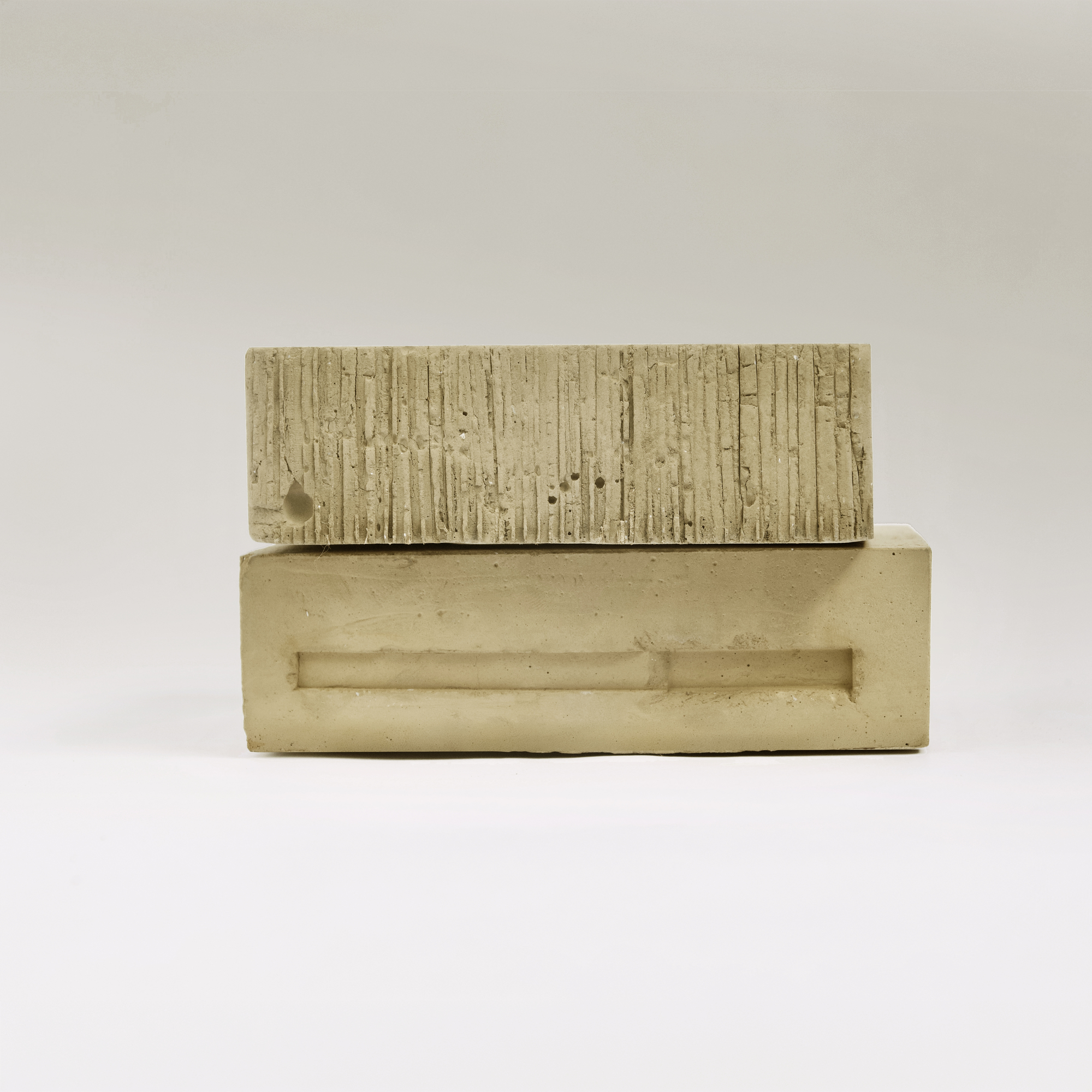 Side view of concrete model displaying vertical board-formed texture and recessed horizontal element