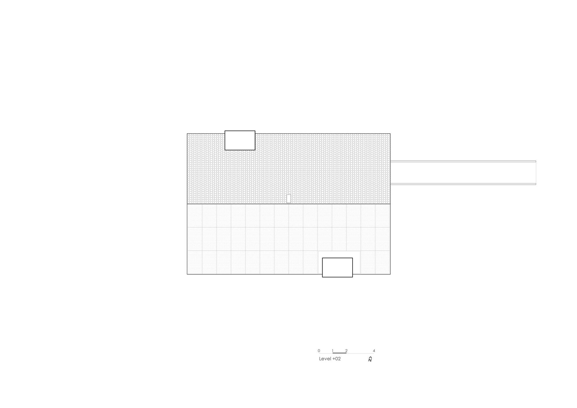 Roof plan drawing showing a rectangular structure with two skylight openings and an attached linear extension