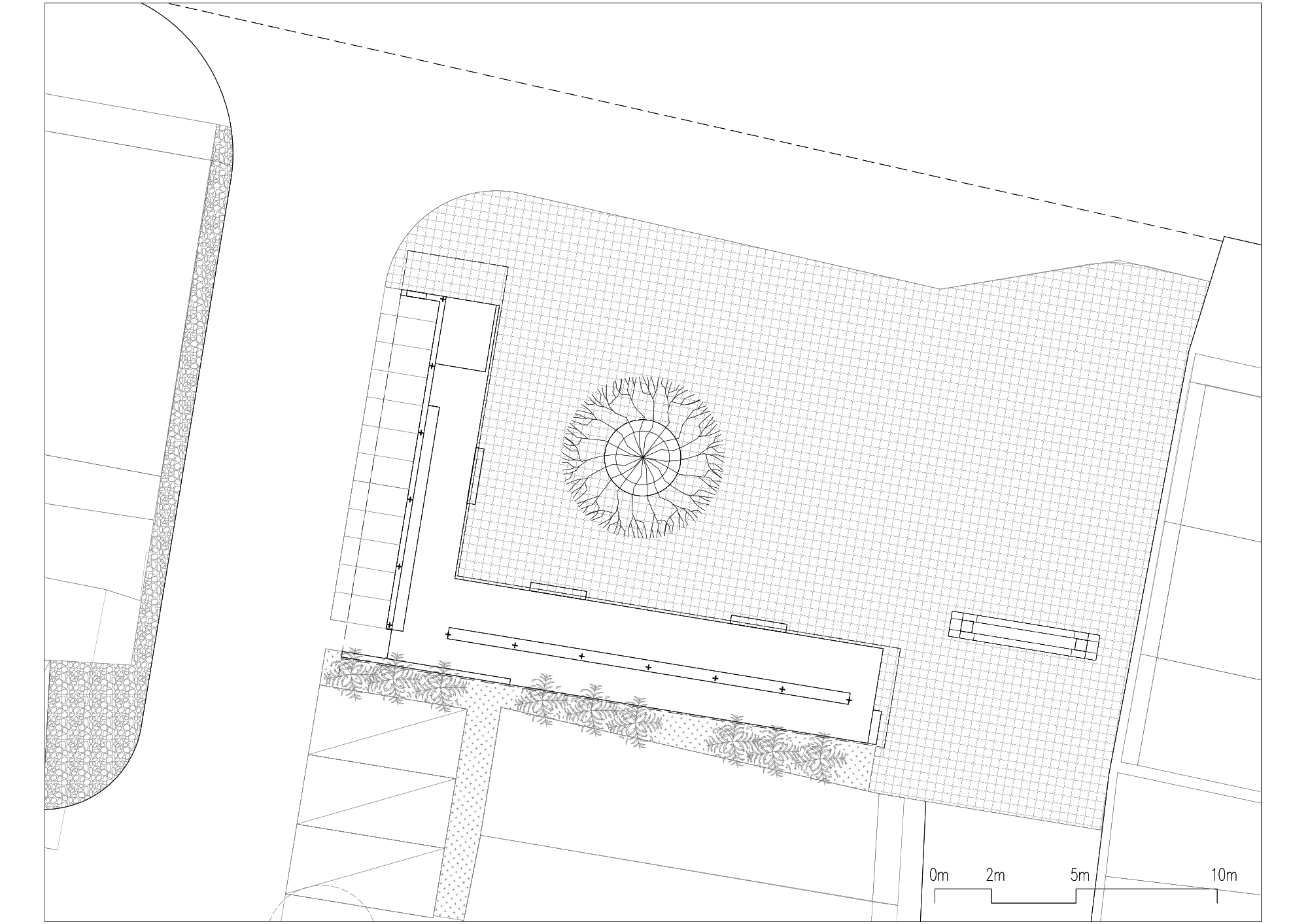Site plan drawing showing a rectangular building with a central circular courtyard element and adjacent landscaped areas