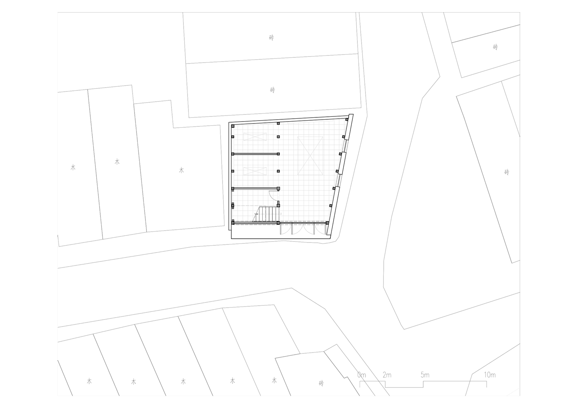 Floor plan drawing showing a compact pentagonal building with parking spaces and a central staircase