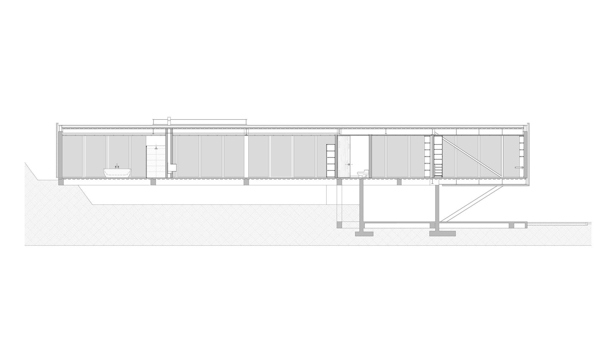 Section drawing showing the elongated interior with columns and diagonal stair connecting levels on the hillside