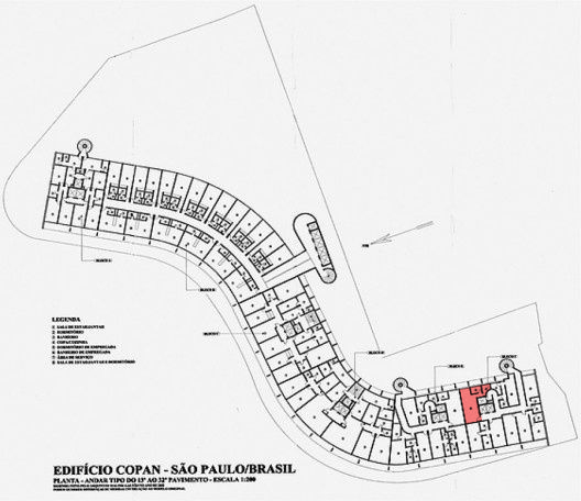 Floor plan drawing of a curving residential tower level, with one apartment unit highlighted in red near the lower right