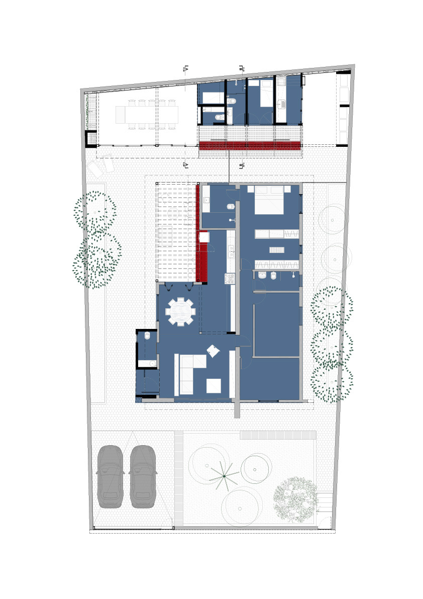 Floor plan drawing showing an L-shaped house around a courtyard, a rear pavilion with dining table, and two parked cars at the front