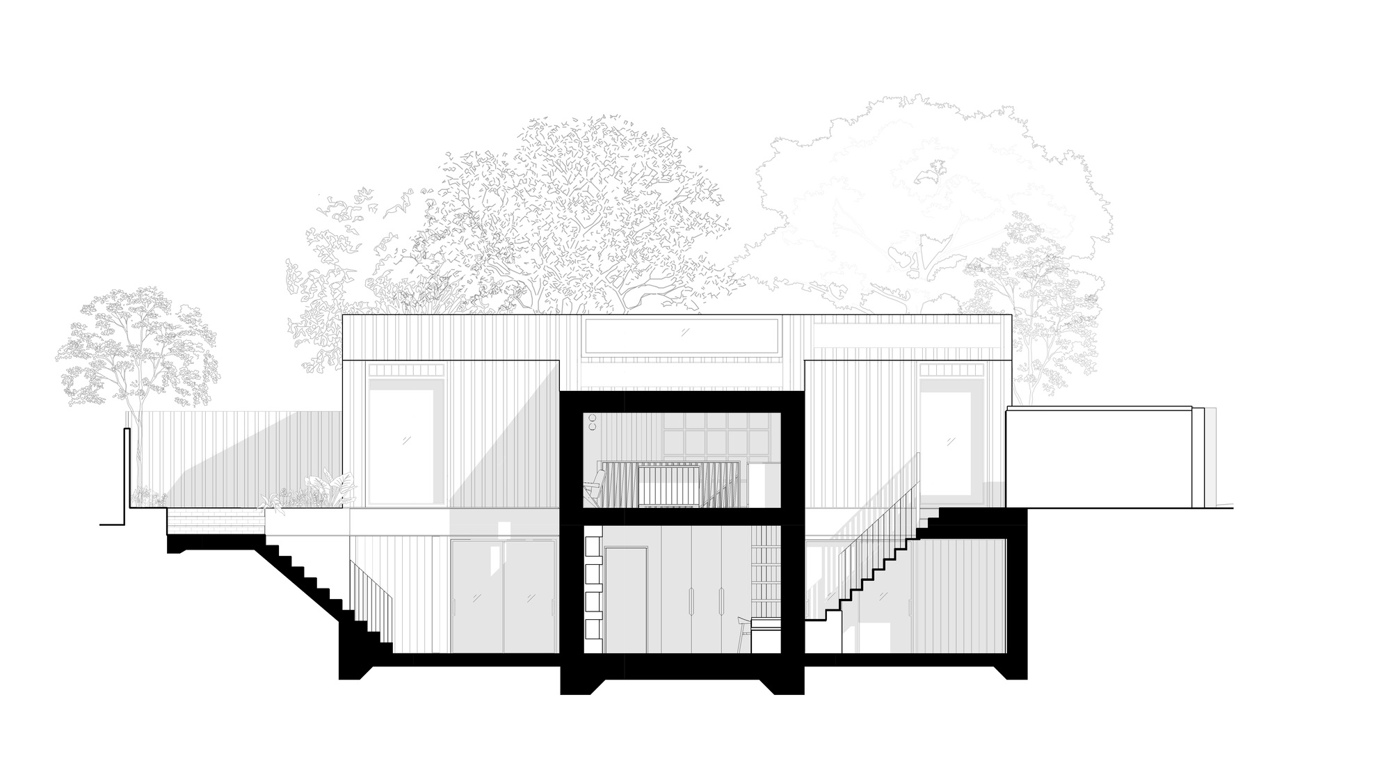 Section drawing of a two-storey house with a central core, sunken side courtyards with stairs, and tree outlines behind