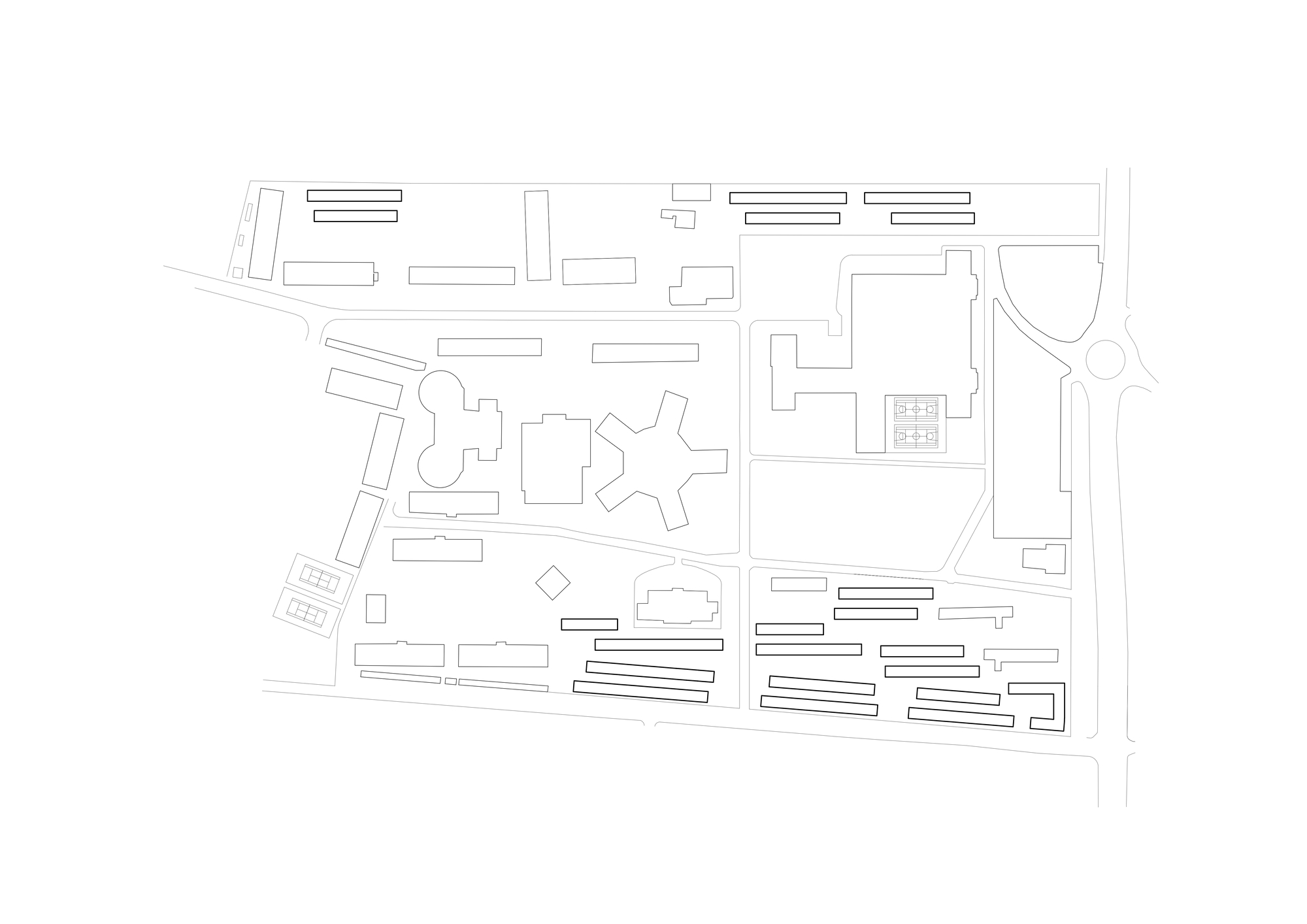 Site plan drawing showing rows of slim bar buildings around star-shaped and lobed blocks, with roads and a roundabout at the right edge