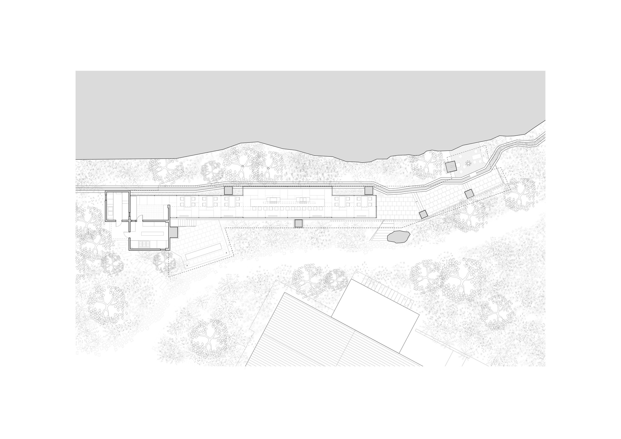 Floor plan drawing of a long linear pavilion with small service rooms at one end, set among trees along a slope