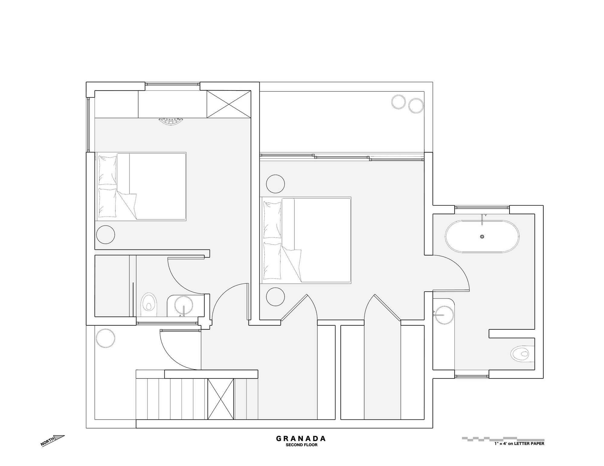 Second floor plan drawing showing two bedrooms with beds, a freestanding tub bathroom, closets and a stair landing