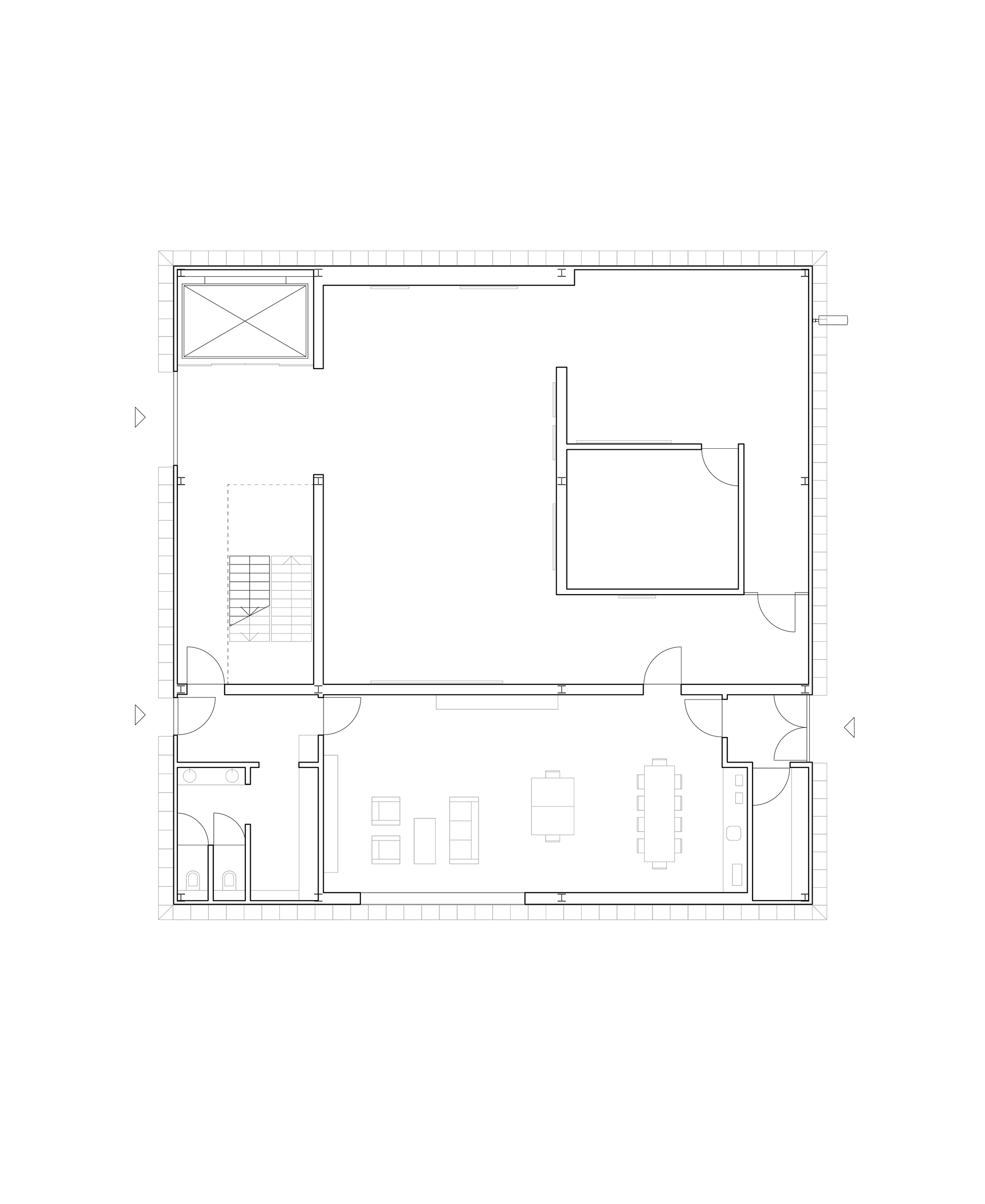 Floor plan drawing of a square building with a large open hall, a stair and lift, and a furnished room with toilets