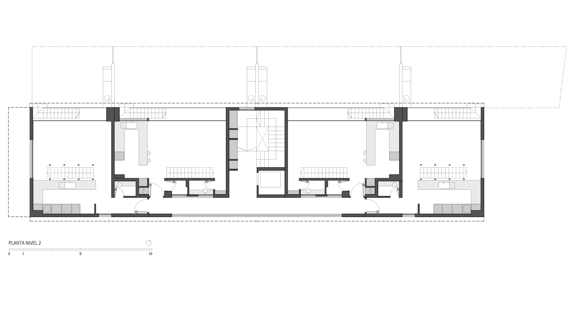 Second level floor plan drawing showing a central stair core flanked by open living areas with kitchens and bathrooms in each wing